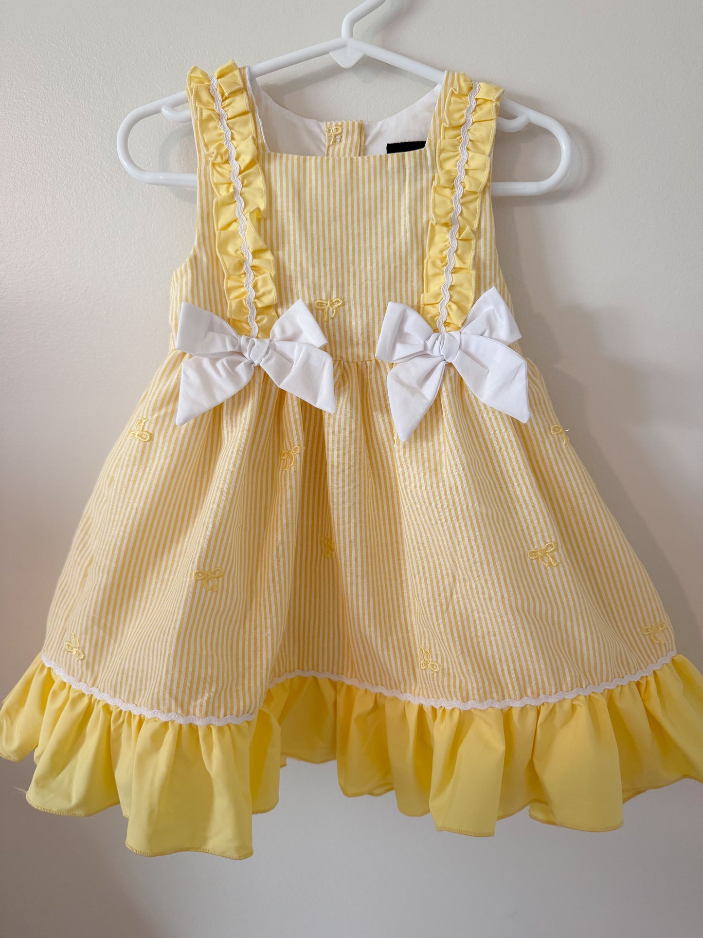 Yellow seersucker dress wirh Embrodiered bows